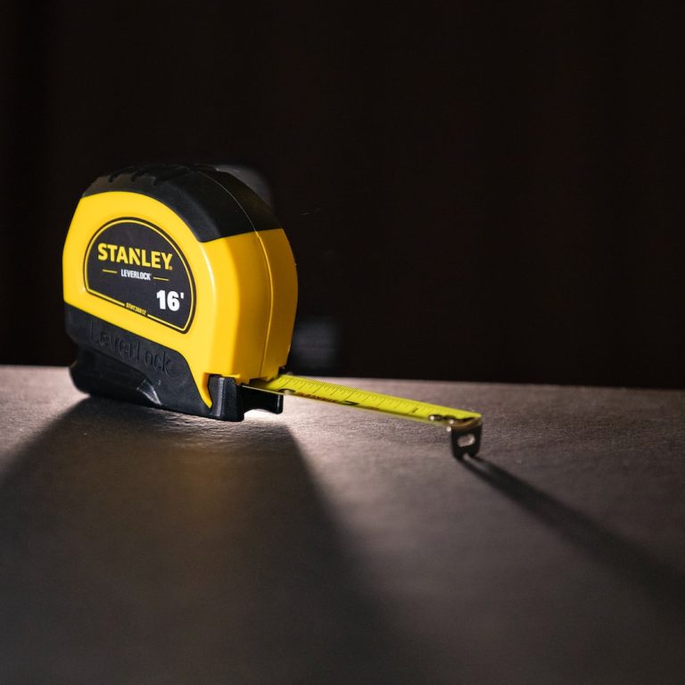 black and yellow Stanley tape measure